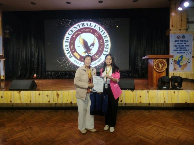 Dr. Shamany L. Lokines turns over the PSA-CAR certificate of appreciation to Dr. Elma D. Donaal